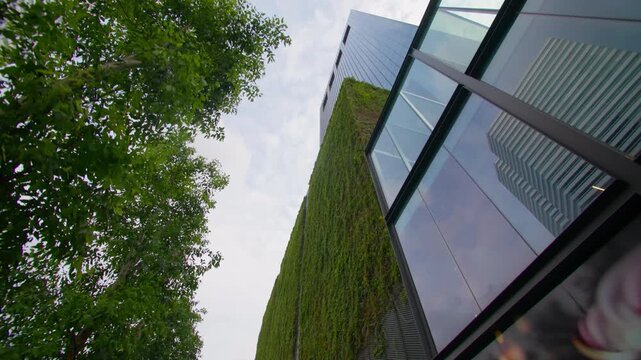 Biophilic architecture and green skyscrapers in Singapore city shaping a futuristic skyline with landscaped facades and world class tourism in Asia