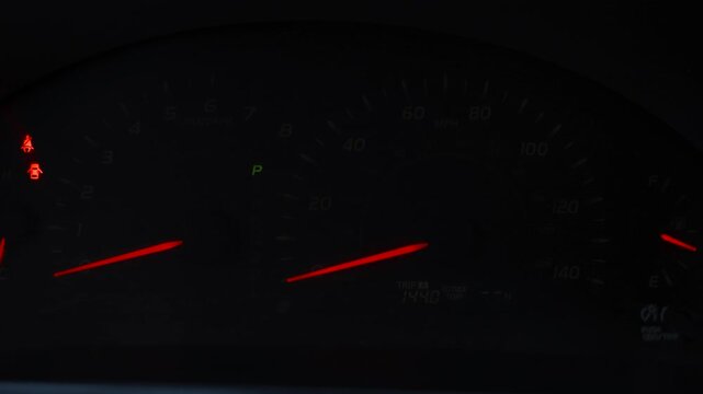 car dashboard speedometer at night