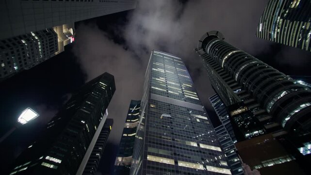 Night cityscape of Singapore featuring modern architecture illuminated office skyscrapers vibrant urban streets and spectacular business district travel in Asia