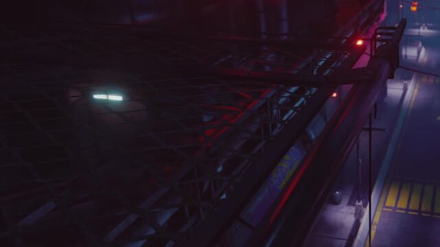 Metal structure looms over a city street at night. Red and blue lights reflect off the surfaces. People walk in the distance, adding life to the urban scene.