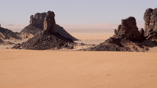 Trip to Sahara desert in Algeria. 
Beautiful african travel photo. Landscape with sandstone 
mountains, sand, sky, nature. Summer vacation in arab country.