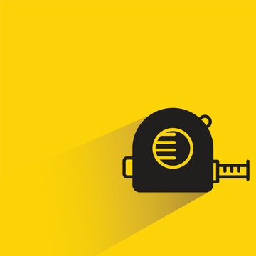 measuring tape icon with shadow on yellow background