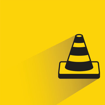 traffic cone icon with shadow on yellow background