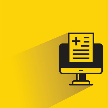 medical file computer with shadow yellow background