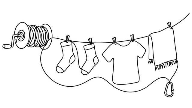 Clothesline with baby clothes on white background.