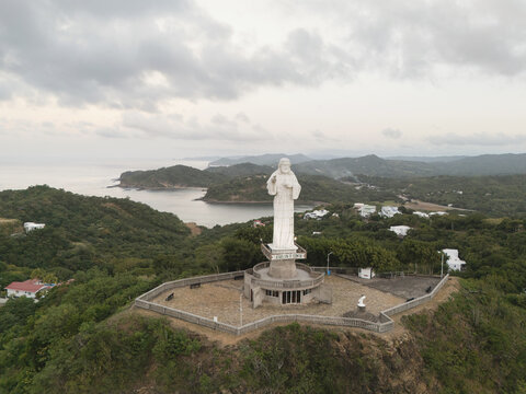 Statue of Jesus in green hill of San Juan Del Sur