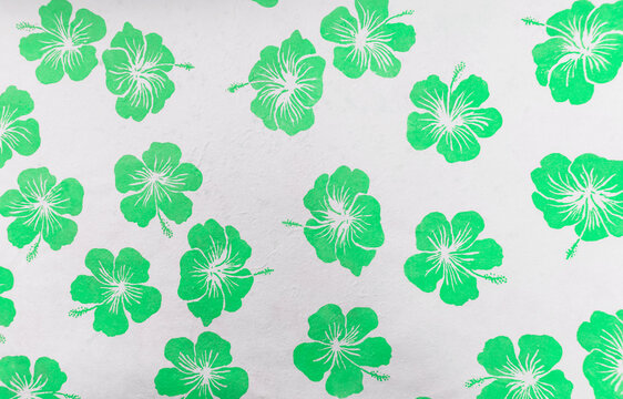 Green hibiscus pattern flower on white paper background, paper with green flower pattern background