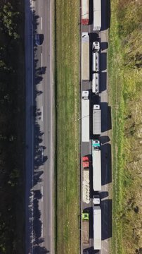 Aerial Top View of Heavy Traffic Jam with Trucks Line on Highway