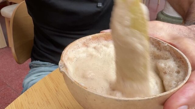 Traditional Oaxacan Tejate Beverage Stirred in Wooden J&iacute;cara Bowl