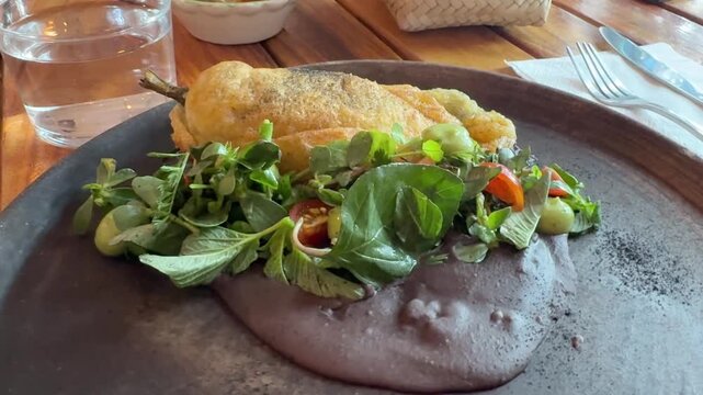 Traditional Mexican Chile Relleno Stuffed Pepper Served with Side Salad and Black Beans