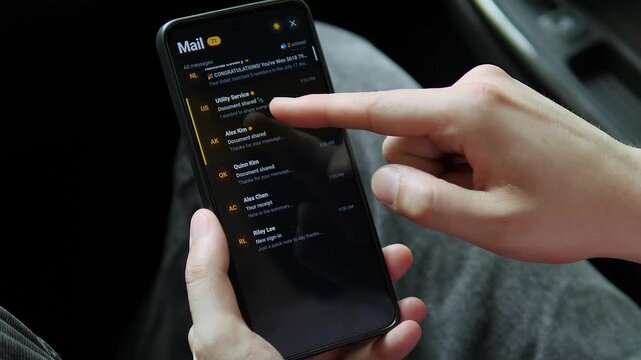 Person scrolls through a mobile inbox and opens a utility bill email, highlighting digital communication, online statements, personal finance and everyday smartphone use.
