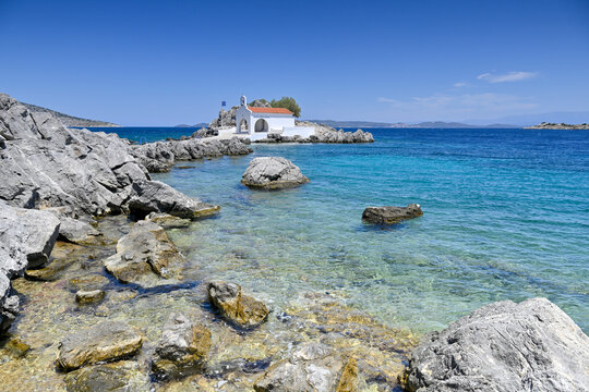 Small church on rocky islet on Greek Island of Chios dedicated to Agios Isidoros   