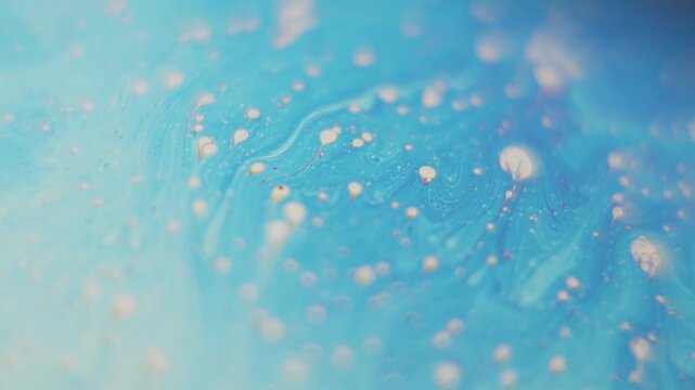 Macro view of colorful soap bubble surface with swirling iridescent liquid patterns and shifting vibrant rainbow spectrum textures.