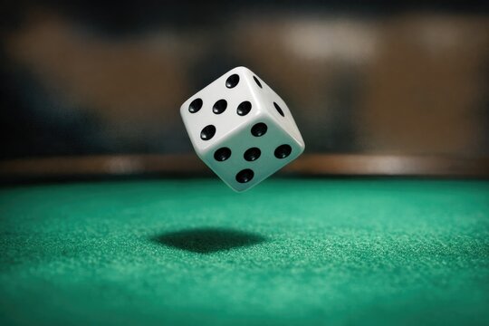 A single die with numbers 1-6, placed on a table