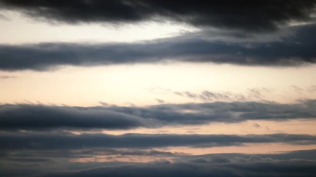 Dramatic clouds rolling and billowing across the sky, cinematic atmospheric background