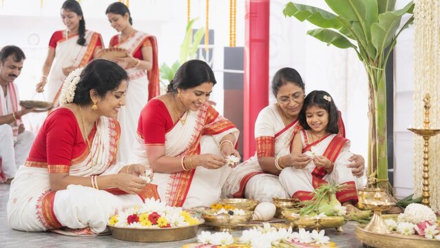 Durga Ashtami concept with women and child preparing a Durga festival offering