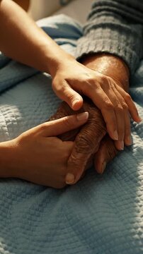 A Tender Moment of Connection: Two Hands, One Heart - The Symbol of Love and Compassion Between Generations in a Gentle Embrace