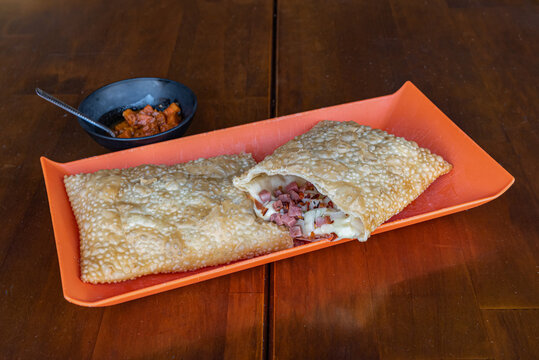 Crispy Brazilian Pastel with Filling and Side Dish
