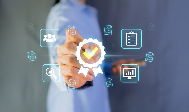 Businessperson touching virtual quality assurance guarantee badge icon with iso standard control concept