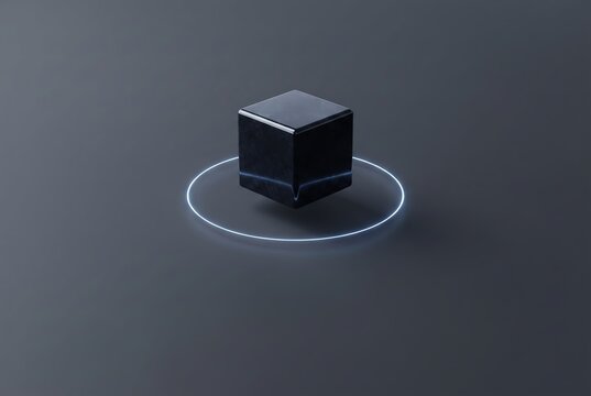 A glossy black cube hovers above a dark surface, encircled by a faint glowing ring, creating a sleek, minimalist, and futuristic visual effect.
