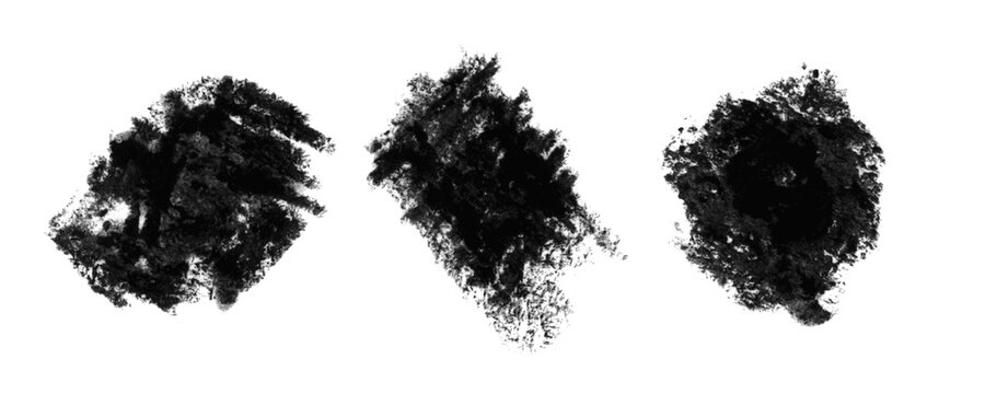 Three black charcoal brush strokes and messy hand drawn ink blobs on a paper texture Background