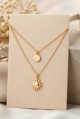 Elegant Layered Thin Gold Necklaces with Sun and Disc Pendants Displayed on White Card with Neutral Background
