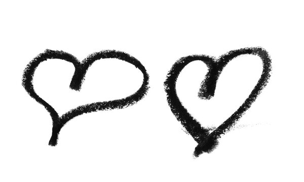 Two hand drawn heart shapes sketched with black charcoal pencil texture Background