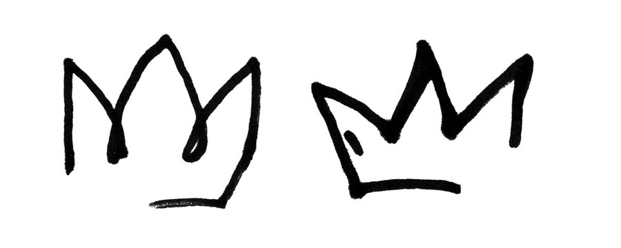 Two simple black hand drawn crown icons sketched with a marker on a paper surface Background