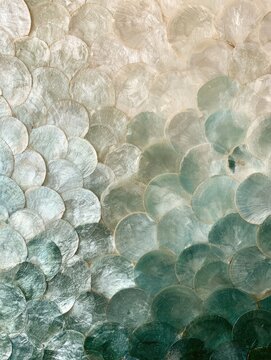 Capiz shell mosaic with a soft ombre transition from white to green, creating an elegant natural decorative texture.
