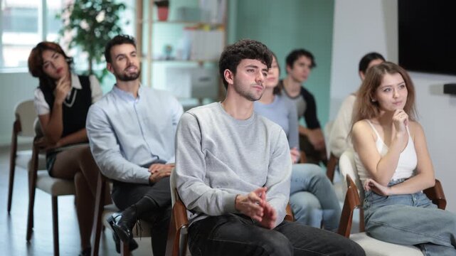 Group of young students paying attention and listening during a classroom training session