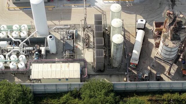 Aerial view of industrial facility featuring cryogenic liquid nitrogen tanks and ambient air vaporizers with a tanker truck parked nearby in Harlow, England, United Kingdom.