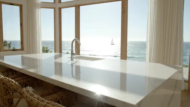 Modern marble kitchen island with ocean view.