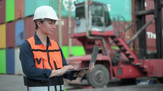 One female logistics worker uses a two way radio and hand signals to direct cargo operations at a shipping container yard. Concept of logistics, freight transport, communication, and supply chain.