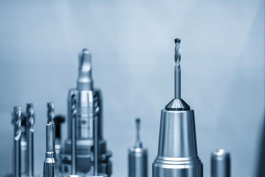Drill tool attached on tool holder prepared for CNC milling machine in light blue tone