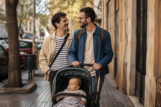 Two Fathers Walking with Their Baby in a Stroller