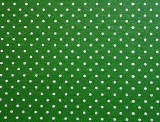 Green polka dot paper texture background © Noelia