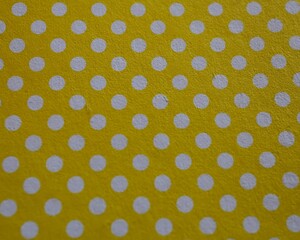 Yellow polka dot paper texture background © Noelia