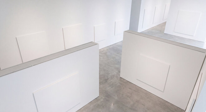 High angle perspective of contemporary art exhibition booths with white partition walls polished concrete floors and blank canvas display mockups