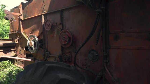 old red combine harvester repair threshing machine replacement of whips on the drum welding work to improve the efficiency of the unit
