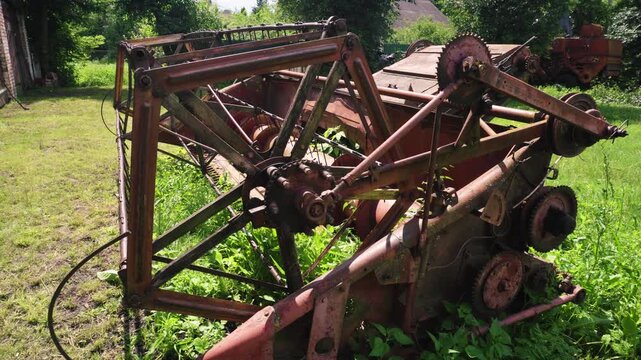 old red combine harvester repair threshing machine replacement of whips on the drum welding work to improve the efficiency of the unit