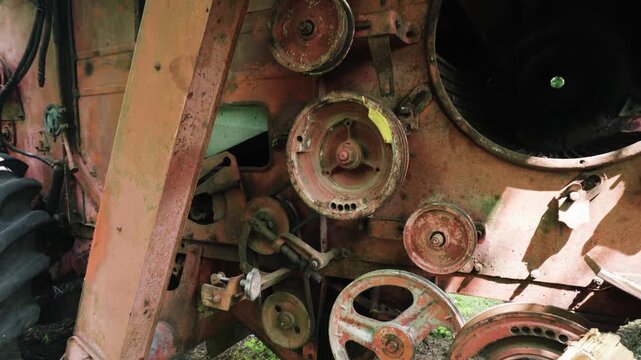 old red combine harvester repair threshing machine replacement of whips on the drum welding work to improve the efficiency of the unit