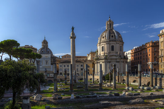 View of Trajan's Column and the Church of the Most Holy Name of Mary at the Trajan Forum in Rome, Lazio, Italy.