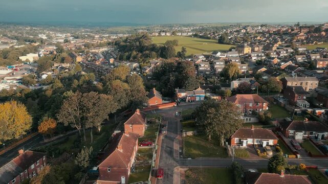 Warm sunlight bathes residential streets and rooftops
