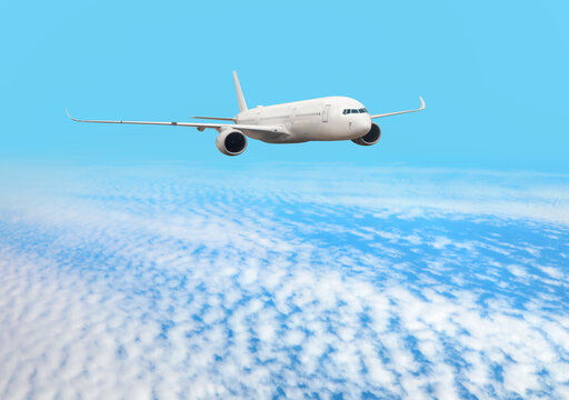 White passenger airplane flying in the sky amazing clouds in the background - Travel by air transport