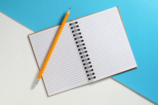 Open Notebook with Pencil