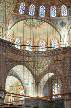 Grand interior of a historic mosque with intricate tilework