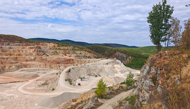 Panoramic view of the Mexiko Valley limestone quarry surrounded by the forested hills of the Bukk Mountains near Miskolc, Hungary.