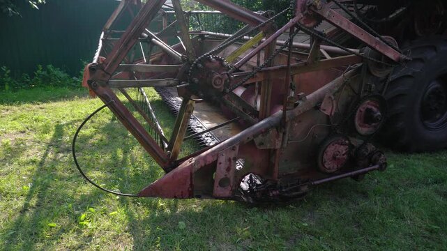 old red combine harvester repair threshing machine replacement of whips on the drum welding work to improve the efficiency of the unit