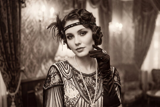 Elegant Vintage Flapper Woman in 1920s Attire with Pearls and Feathers in Sepia Tone