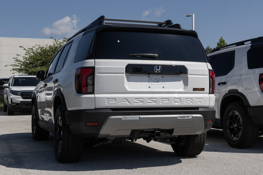Honda Passport TS Elite Off-Road Midsized SUV at a dealership. Honda offers the Passport with a 3.5L V6 engine. MY:2026